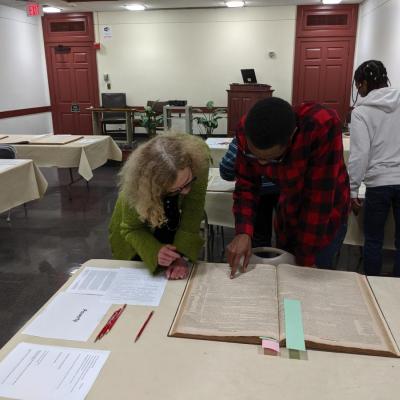 Professor and Student look at BKBB archival item