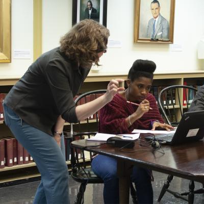 Archivist helping a student